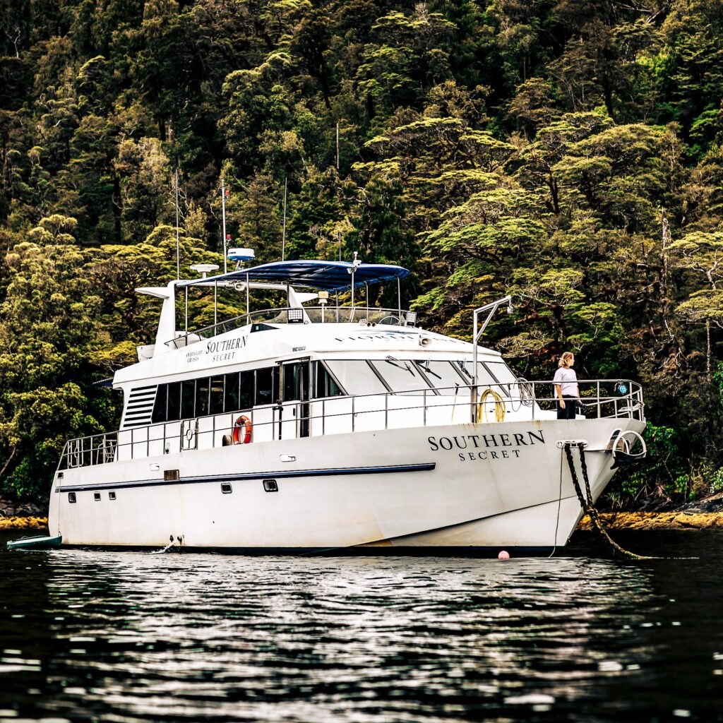 Southern Secret boat cruising through Fiordland